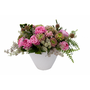 Flower arrangement in a medium tall, oval, white, ceramic vase, antique green hydrangeas, pink garden roses, pink peonies, pink and green ranunculus, white astrantia, seeded eucalyptus and scabiosa pods.